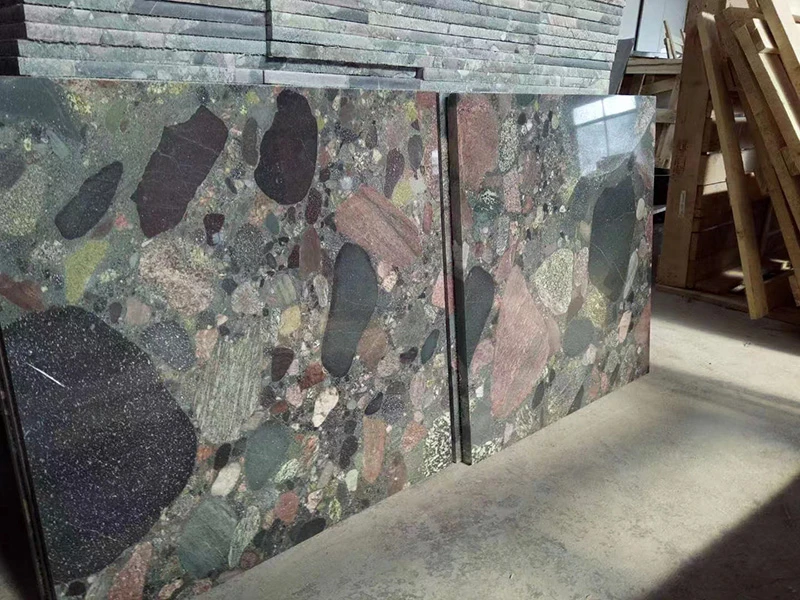 kitchen with red granite countertops